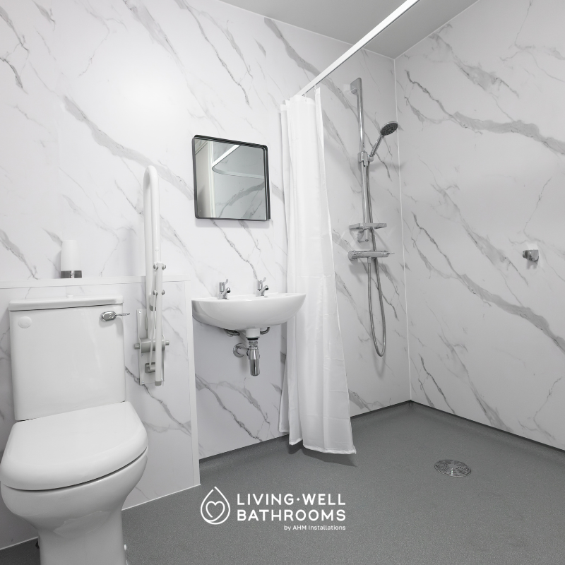 Grey safety flooring in an accessible level-access wet room
