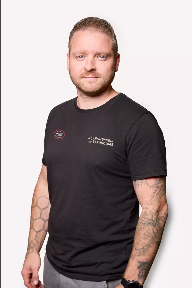 Callum- Technical Manager at Living Well Bathrooms looking at camera
