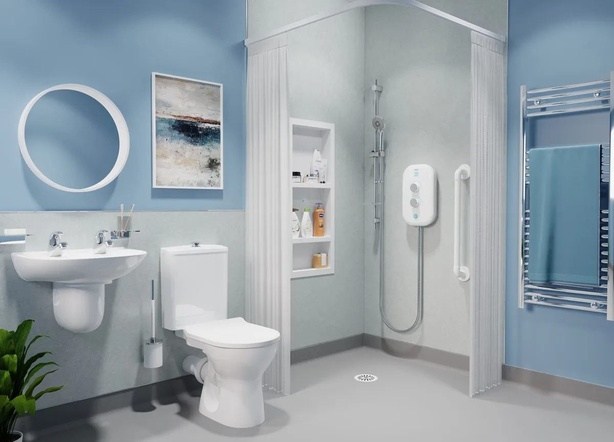 Blue and grey wet room with a level-access shower, curtain, grab rail, basin and toilet.